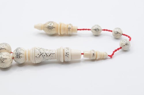 عاج ناب الفيل مطعم بالفضة