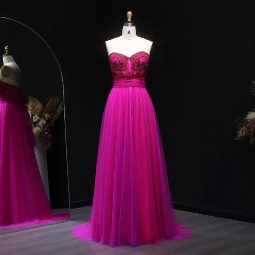 Elegant evening dress made of chiffon decorated with beads, with a corset system, sleeveless