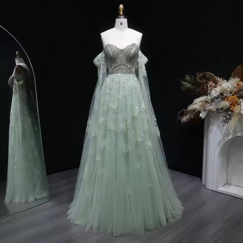 Evening dress with detailed bodice, strapless, with cape, fabric decorated with flowers, hand-stitched.