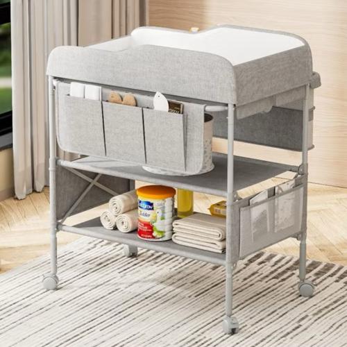 طاولة غيار وتنضيم اغراض الطفل قابلة للطي