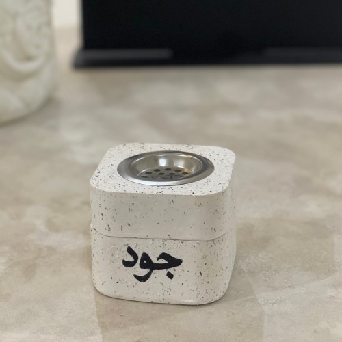A perfume diffuser with a incense box with the nam...