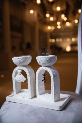 A set of bridal incense burners with a stone effec...