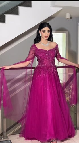 Royal Fuchsia | فستان فوشي بتطريز كريستال وأكمام ت...