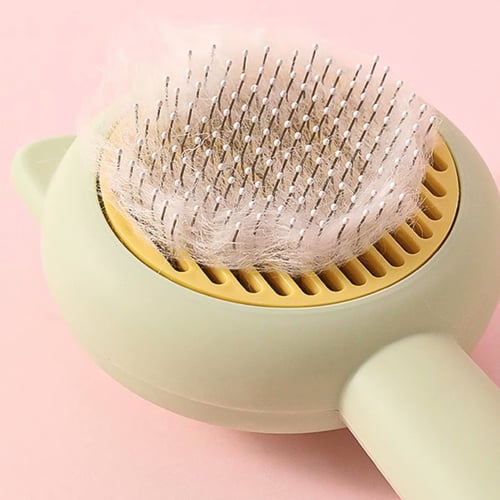 مشط بكبسة تنظيف ذاتي للقطط والكلاب