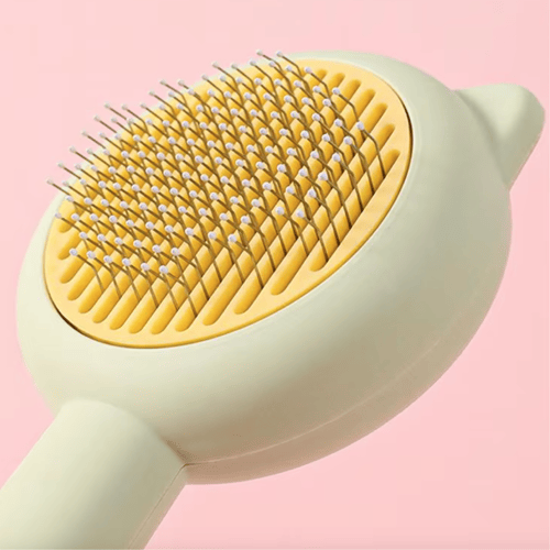 مشط بكبسة تنظيف ذاتي للقطط والكلاب