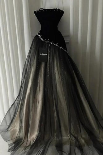 فستان سهر اسود وذهبي مزين باللؤلؤ