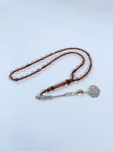 سبحة بكلايت شفافة بخيط بني