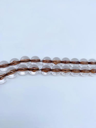 سبحة بكلايت شفافة بخيط بني