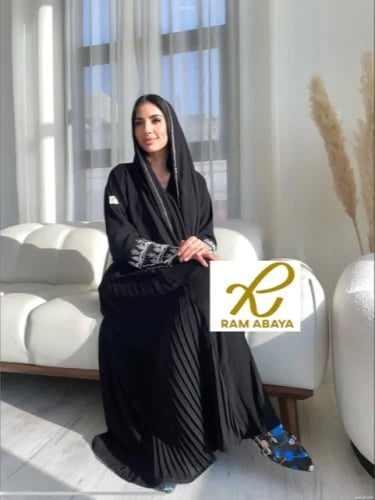 Black royal abaya with flared design, side slits, and a crystal mesh detail.