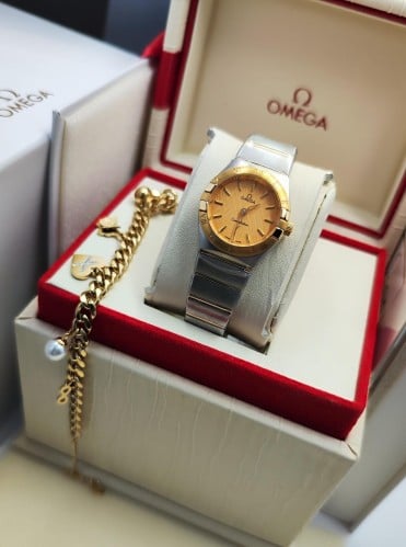 Omega women's watch, gold or silver