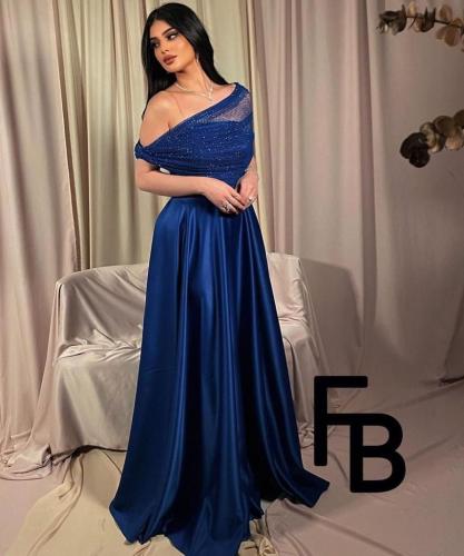 فستان سهرة نيلي بفصوص راقية جدًا – من كيوتشي CUTEC...