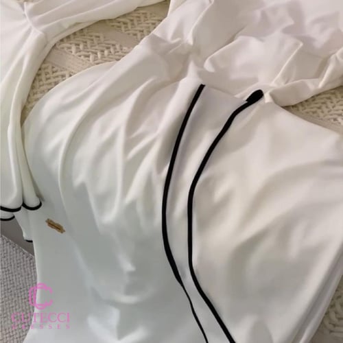 فستان سهرة أبيض بأكمام واسعة