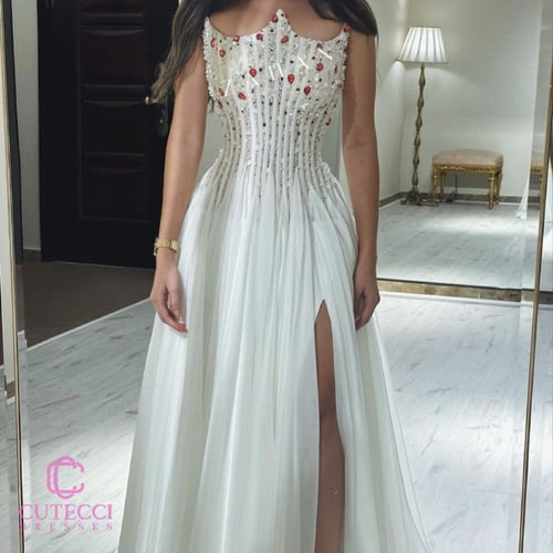 فستان ابيض سهرة صدر مطرز من كيوتشي CUTECCI