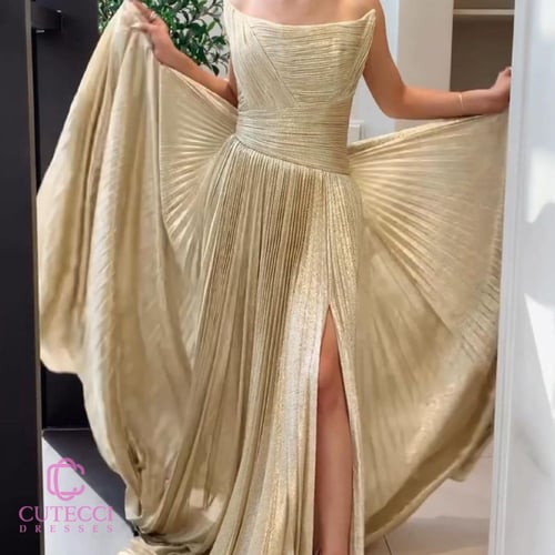 فستان سهرة ذهبي بكسرات لماعة