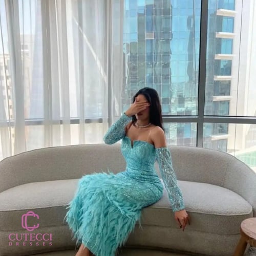 فستان سهرة تركوازي تطريز وريش فاخر