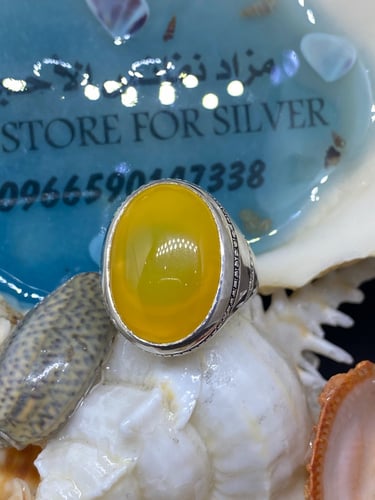 خاتم الفضة بحجر عقيق يمني أصفر بصياغة غلام عيار ال...