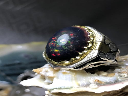 خاتم فضه بحجر الاوبال الاثيوبي مرصع بالالماس (4) ص...