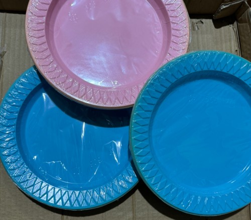A dozen plastic party plates