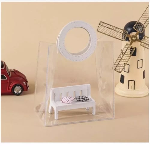 كيس شفاف بمقبض جلد