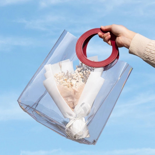 كيس شفاف بمقبض جلد