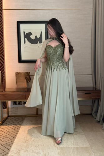 فستان سهره بكورسيه وكاب شيفون باللون زيتي فانح