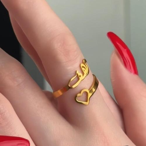 A name ring connected to a heart with a very uniqu...