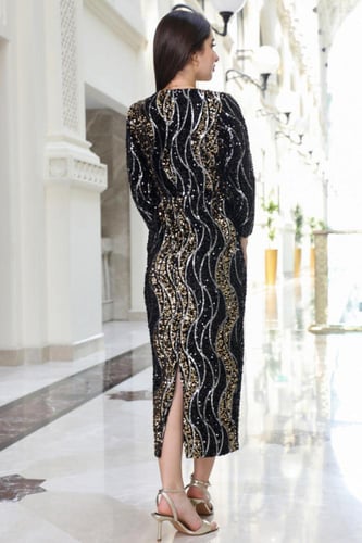 فستان سهرة اصفر ترتر ميدي بفتحة