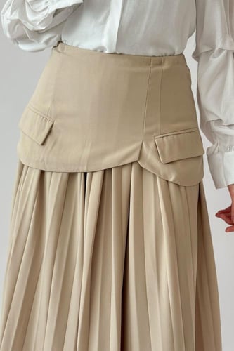 تنوره بليسيه بتصميم مقسم لون بيج