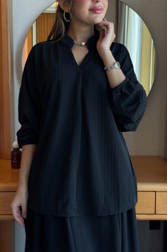 قميص بقصة واسعة لون اسود