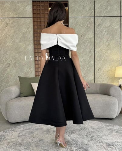 فستان أسود كورسيه بزهرة بيضاء