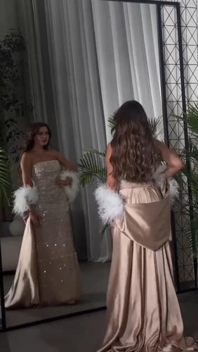 فستان سهره خرز والذيل ميكادو المزين بالريش