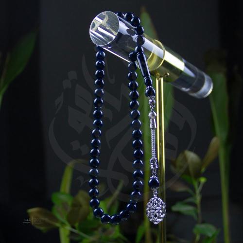 سبحة بلون كحلي غامق طربزونة وخرز دائري صك شبيه بكل...