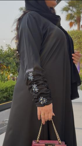 Silk abaya with wide style decorated with embroidery and with a slit from the back