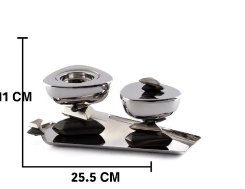 A stainless steel incense burner set with a luxuri...