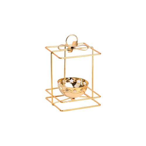 Candle holder with a golden cage and a flower