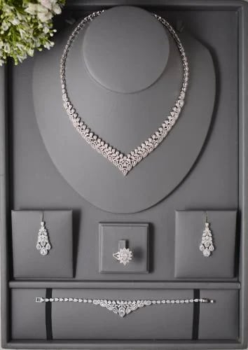 Elegant jewelry set with a coordinated flower desi...