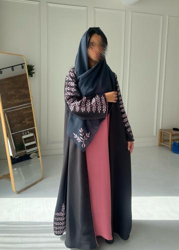 Pink dress under the abaya