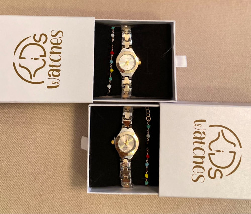 ساعة مواليد فضي وذهبي