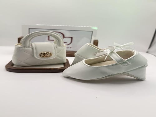 طقم كعب سفنجي وشنطة شبيهة شانيل للمواليد