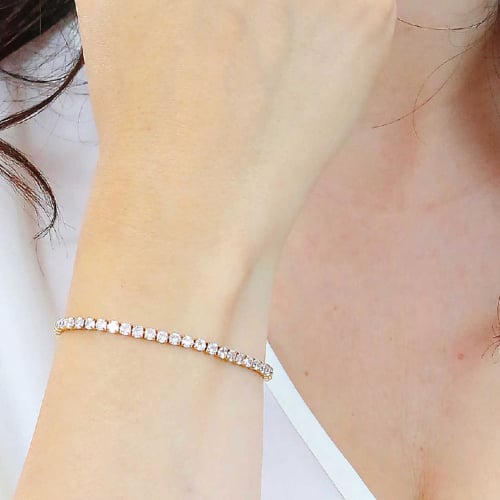 اسوارة تنس ذهبيه بالكرستالات البيضاء ماركة لوكا با...