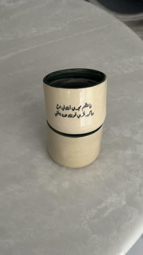 كوب بعبارة ( فـأعظم مجدي أنك لي ابٌ ‏وأكبر فخري قو...