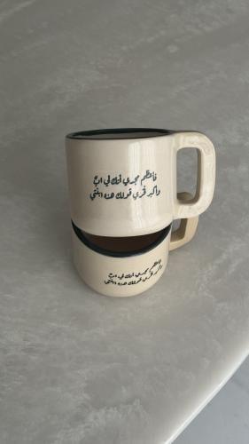 كوب بعبارة ( فـأعظم مجدي أنك لي ابٌ ‏وأكبر فخري قو...