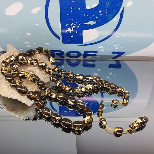 سبحة فريدة من الكهرمان والعاج الطبيعي