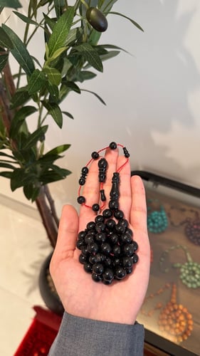 Polishing prayer beads