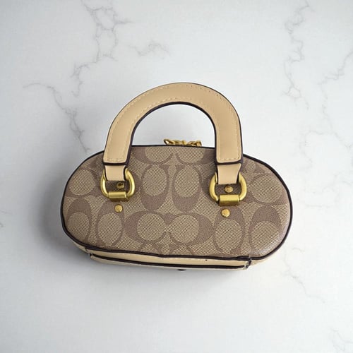 حقيبة كوتش ميك اب ميني براون بيج