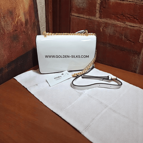 حقيبة كوتش لماع أبيض تابي