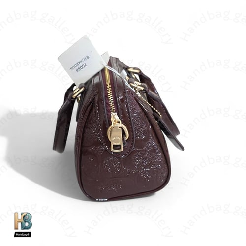 حقيبة كوتش روان عنابي ميني لماع