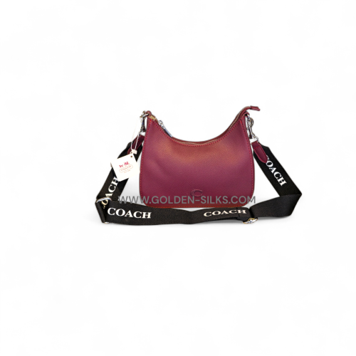 حقيبة هوبو الكروس بودي بنقشة ماركة كوتش عنابي