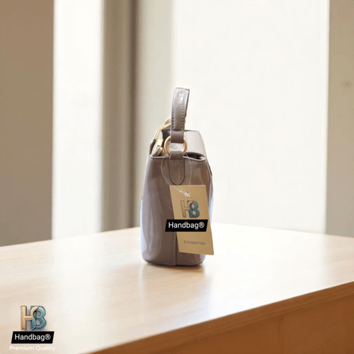 شنطة كوتش Aurora Mini بيج فاتح لماع