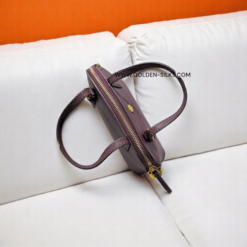 حقيبة توري بورش ميني برغندي مطفي